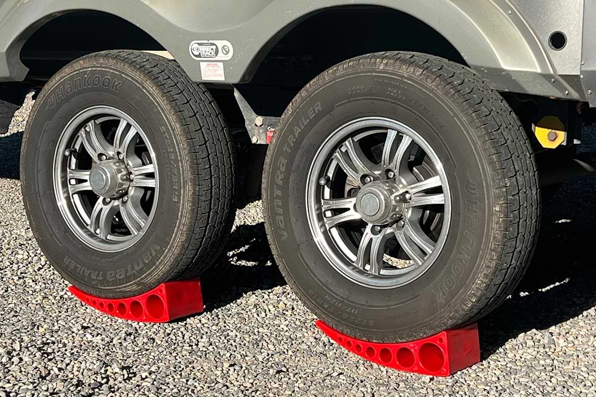 view of two RV tires atop two Andersen Camper Levelers