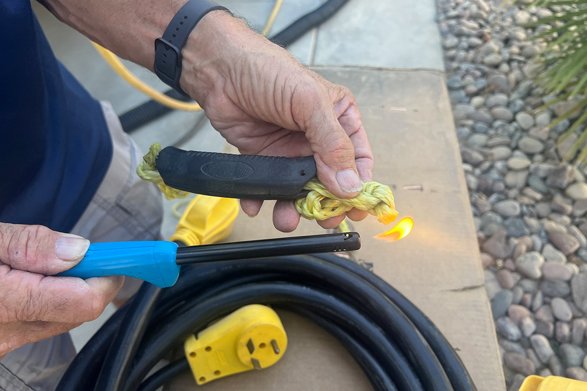 with the desired rope handle length determined, the other end of the polypropylene rope is burned with a torch lighter to prevent unravelling