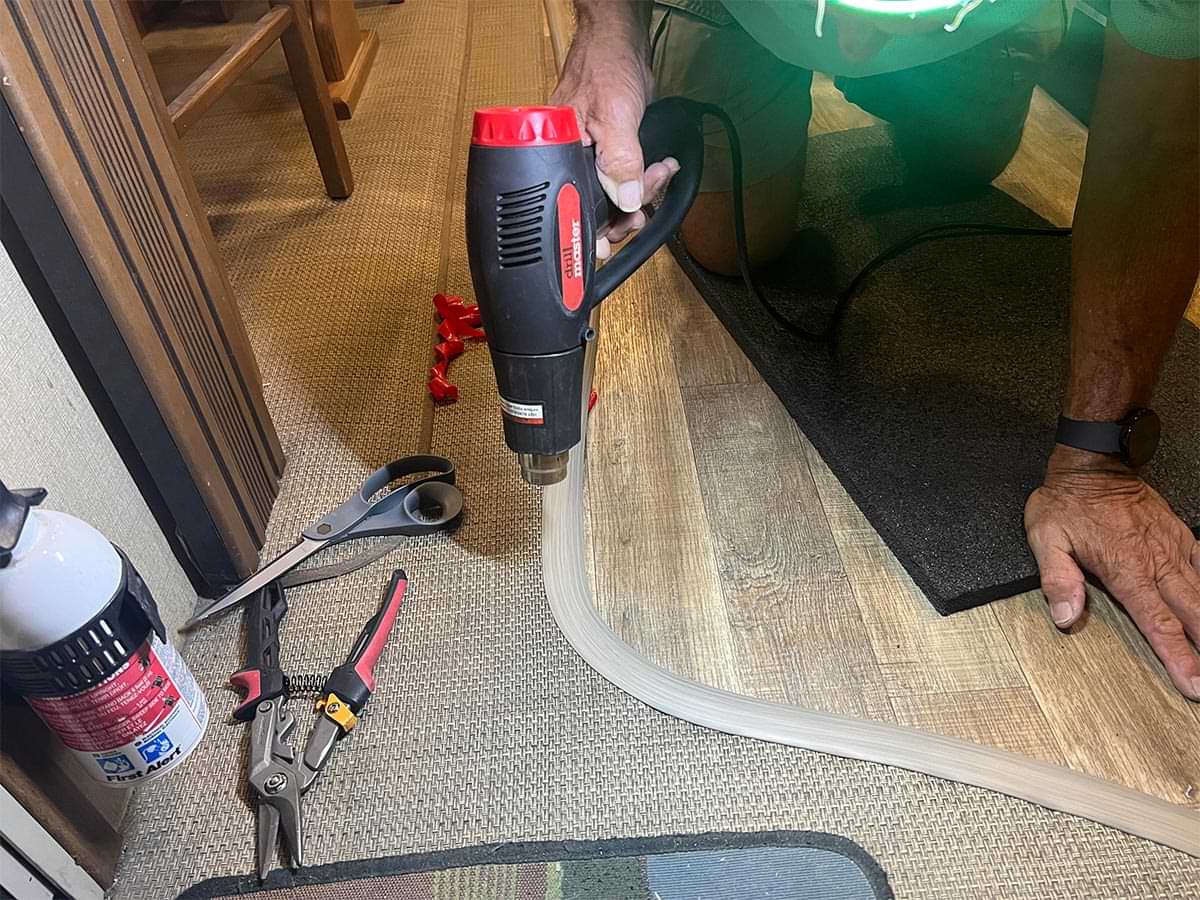 a heat gun is used to make sure the transition strip maintains its shape