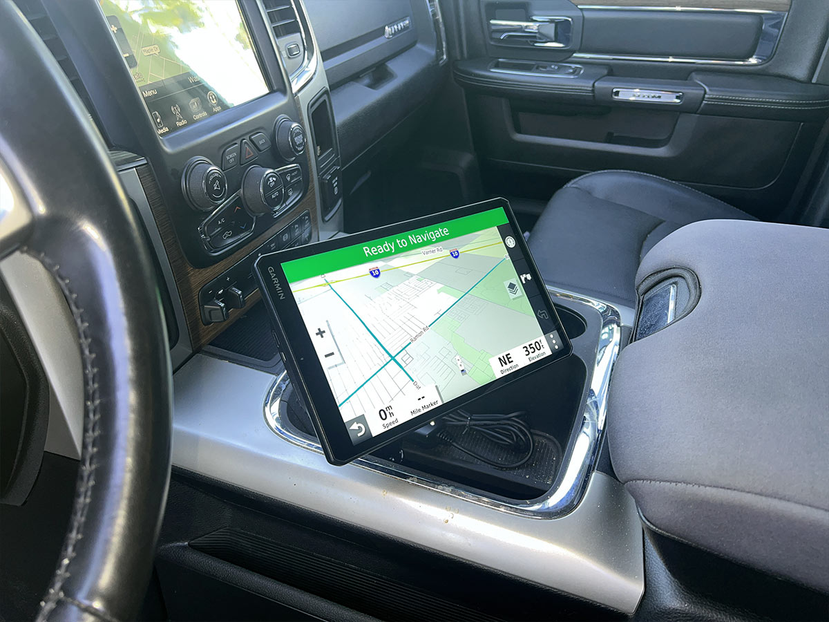 view of the GPS monitor mounted to the vehicle center console and turned in the direction of the drivers seat