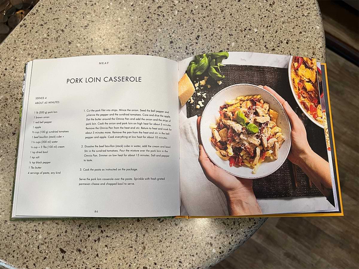 the Omnia cookbook open to the Pork Loin Casserole page