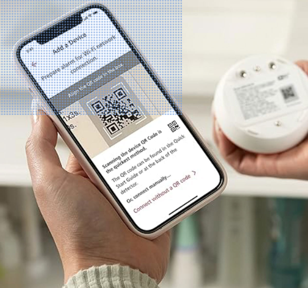 close view of a hand holding a smartphone displaying a QR code for Wi-Fi connection screen