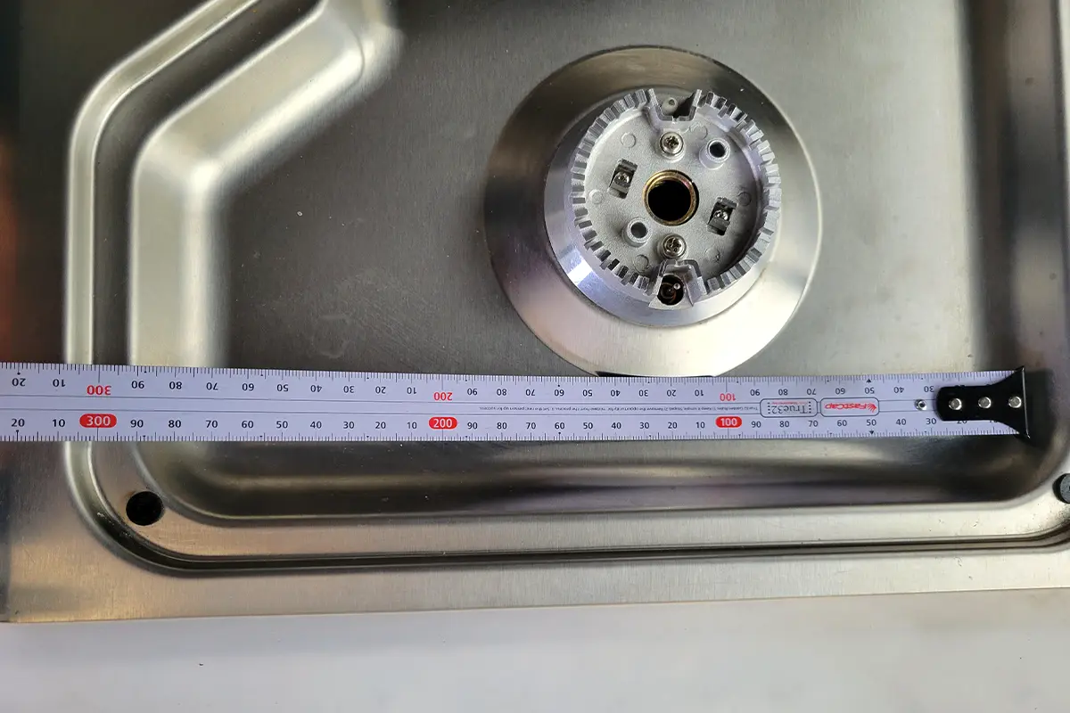 a standard measuring tape is used to find the center points for the burners