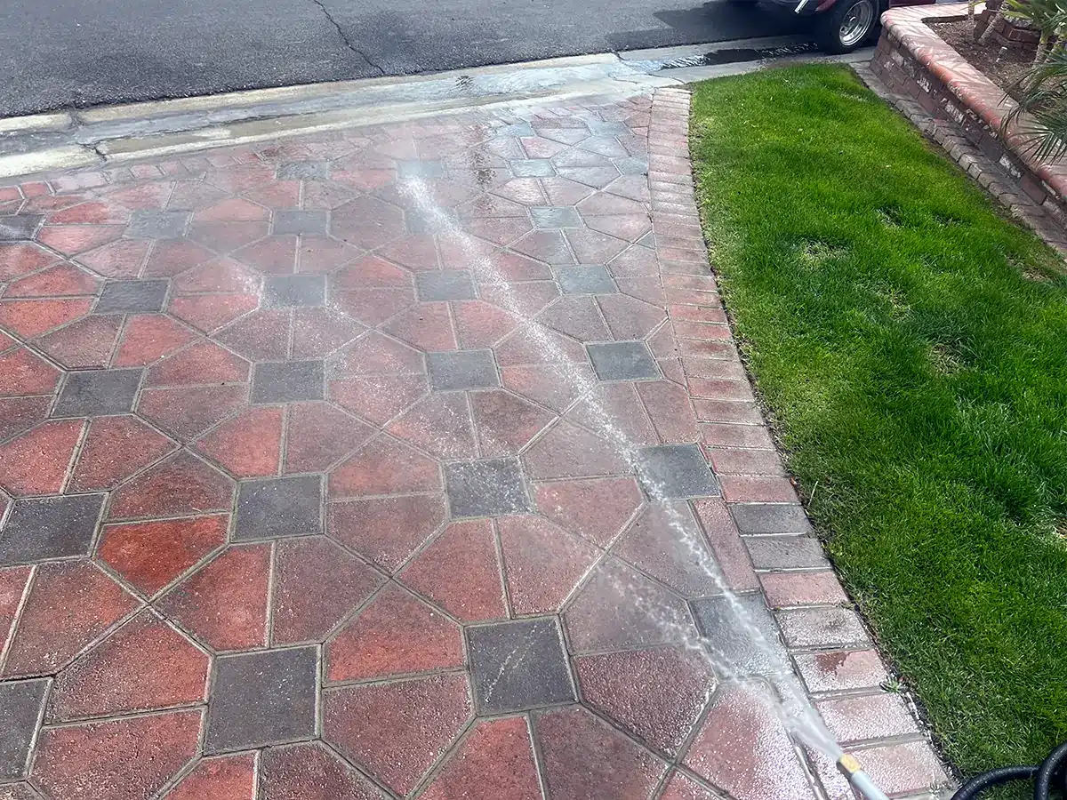 a drive way is sprayed with the Turbo Jet Power Washer with the fan nozzle attached