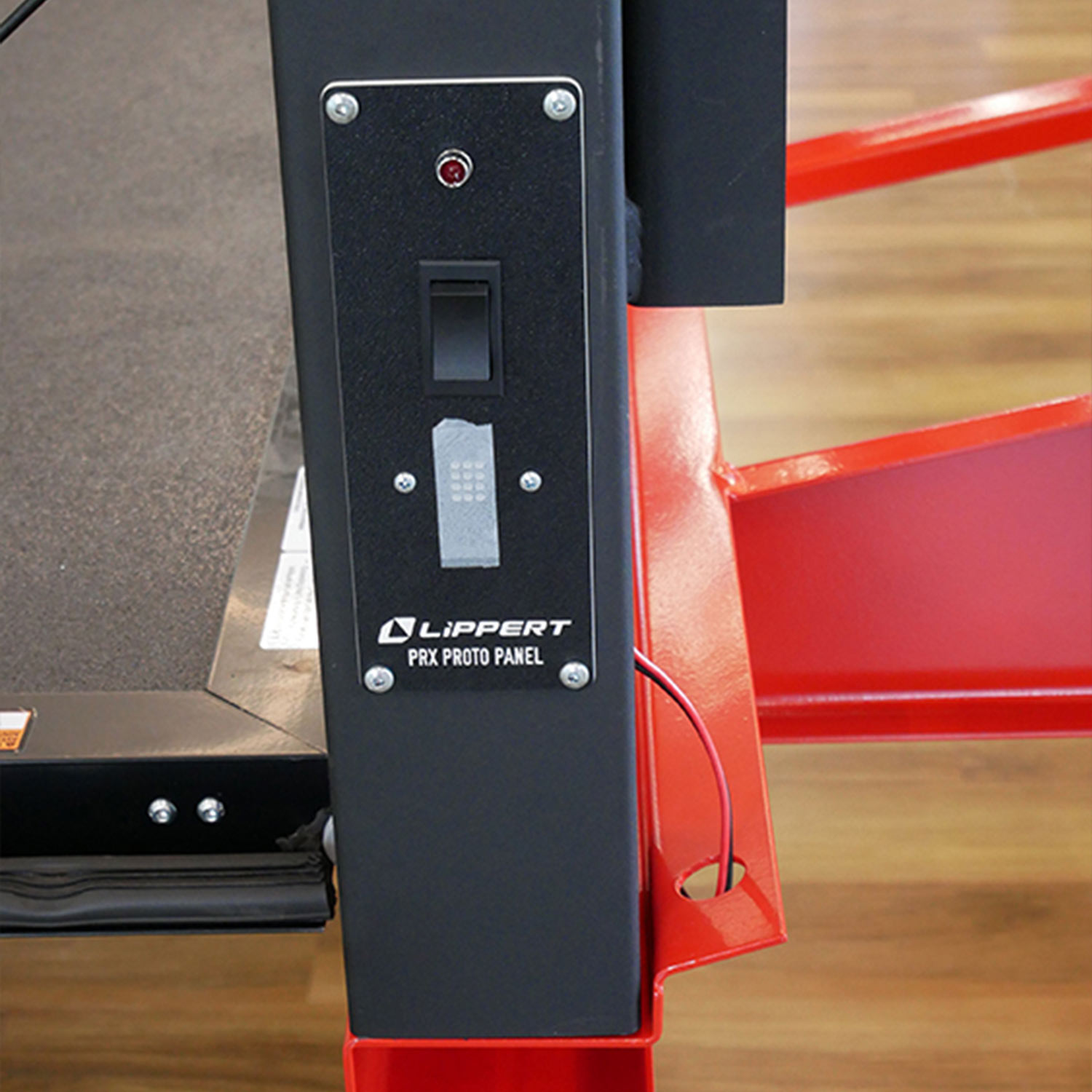 close up of the control button for the Lippert PRX2 Power Ramp Door