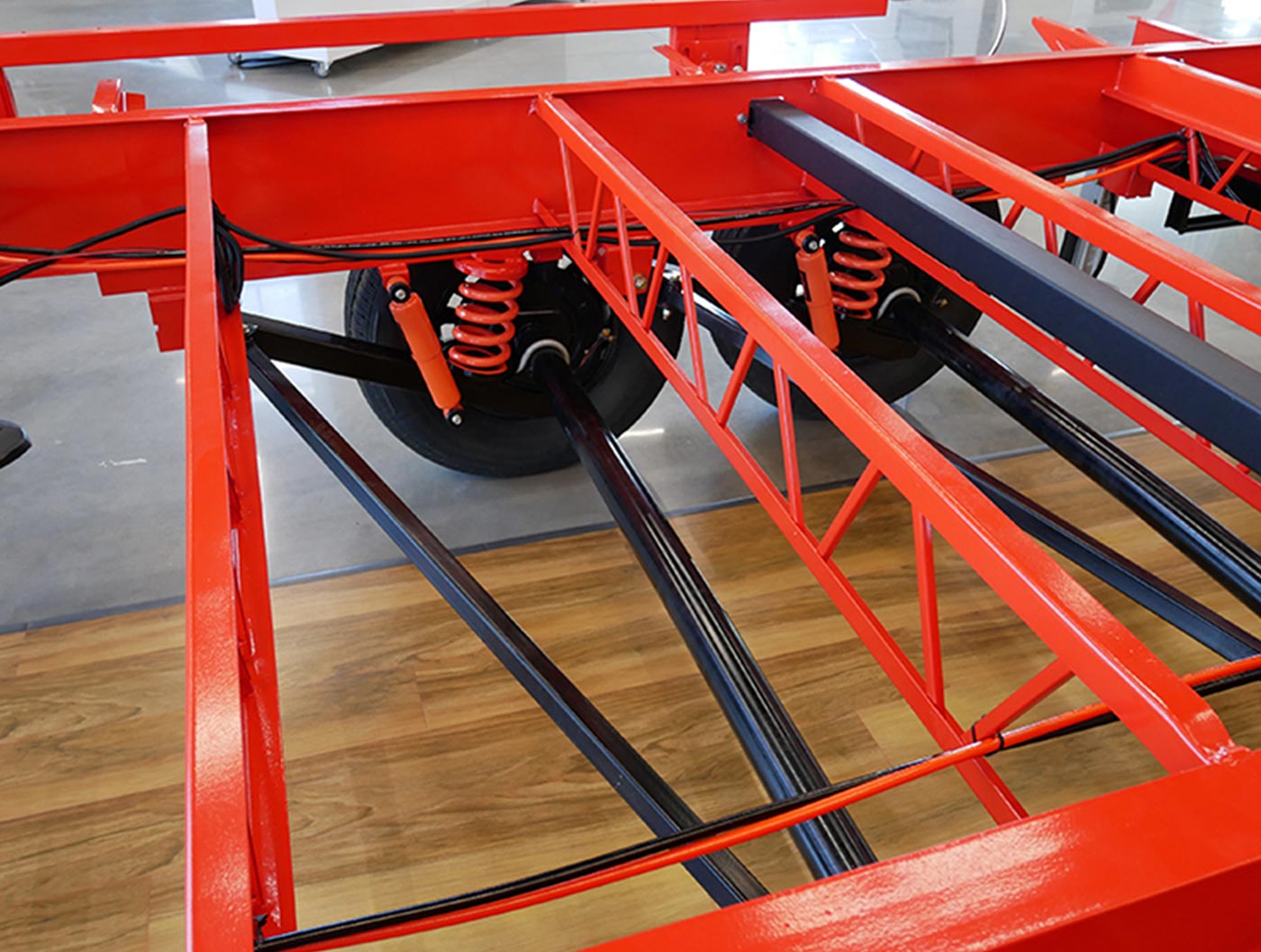 view of a bright red chassis with a focus on the suspension area