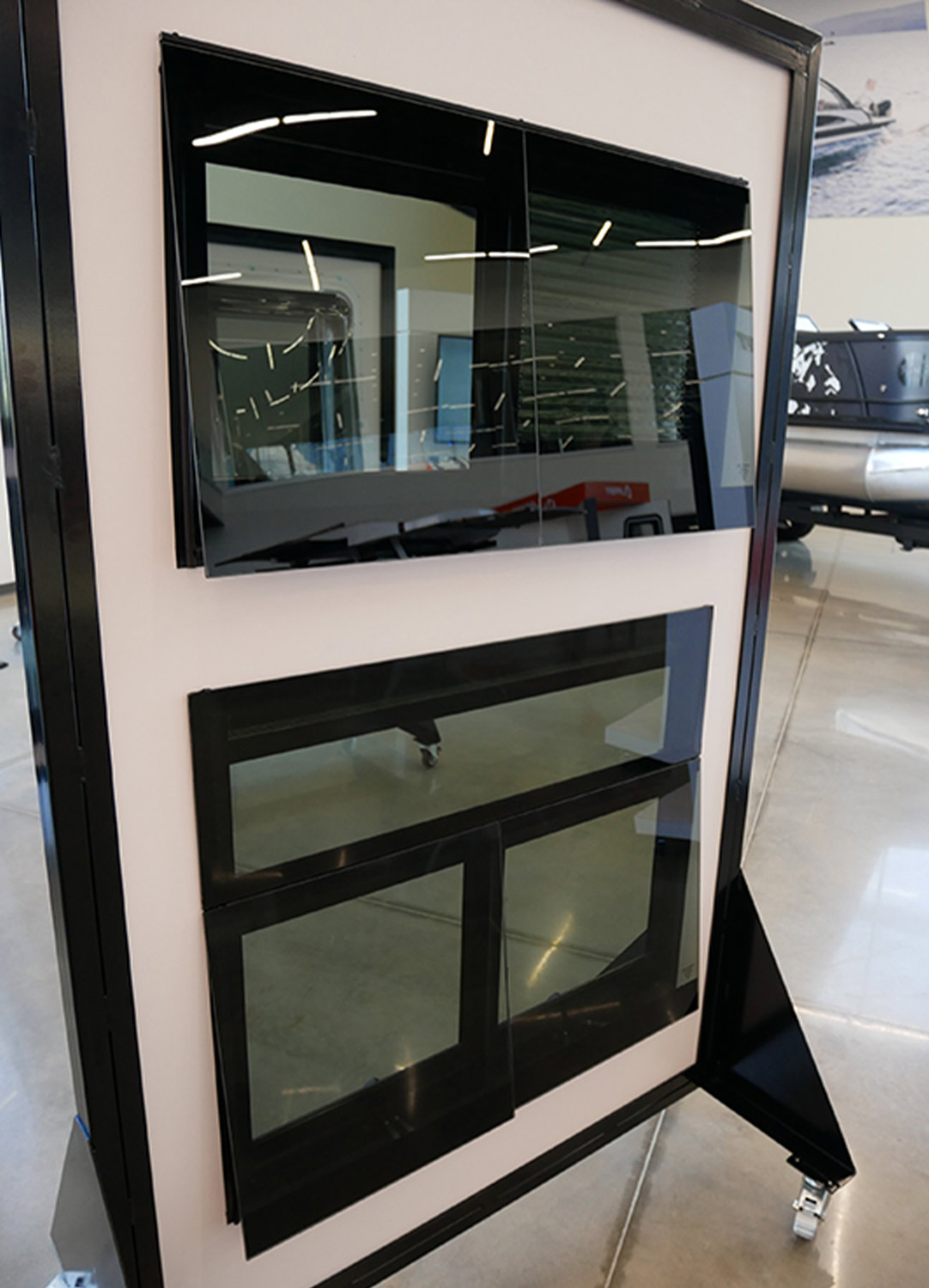 a rolling display that features Lippert designed automotive-style square frameless windows