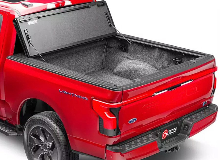 red truck with open bed cover