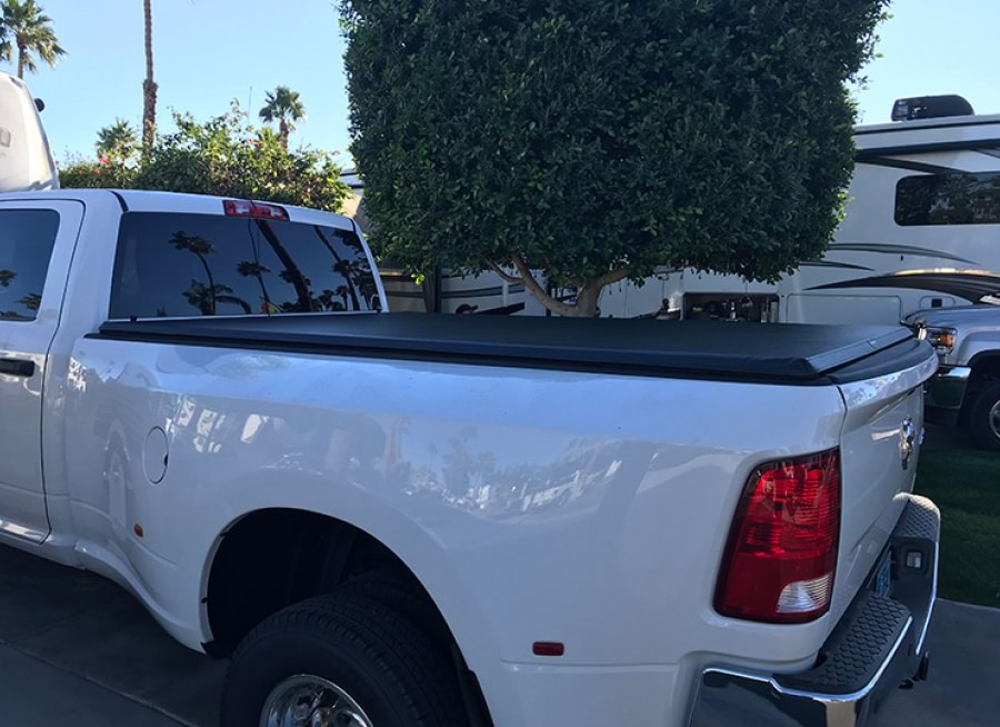 white truck with closed bed cover