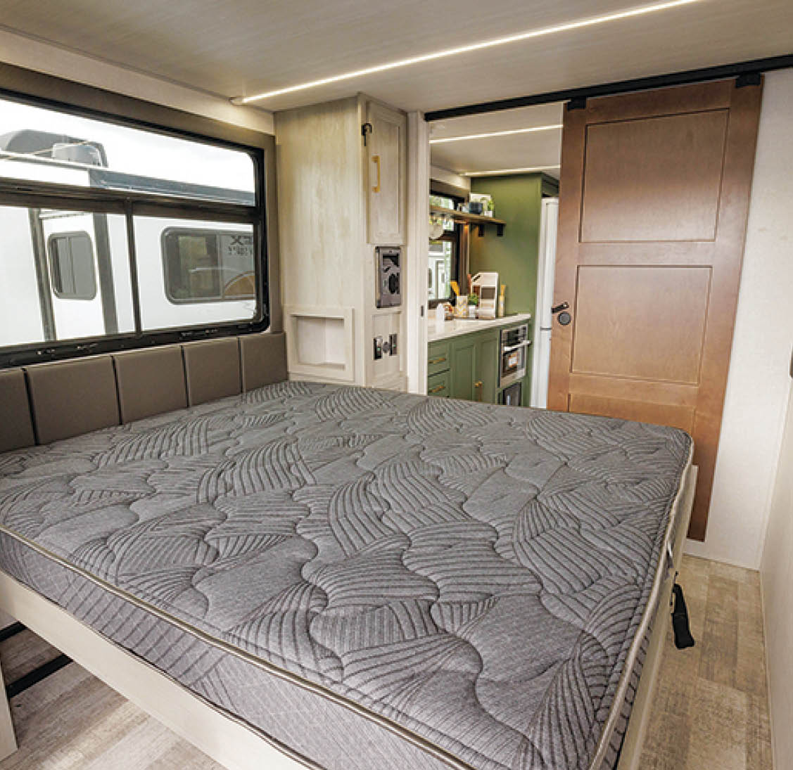 king sized mattress bedroom in an RV