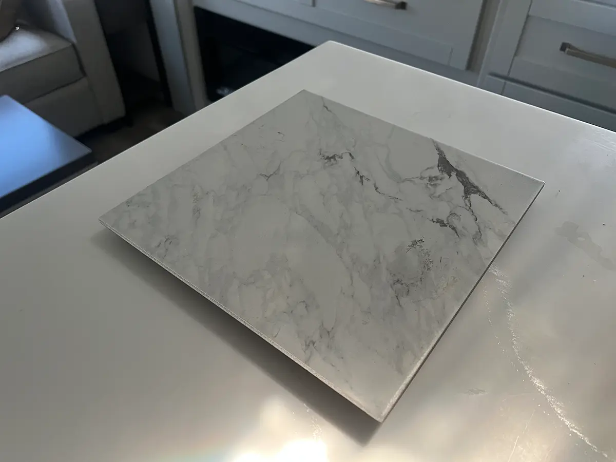 a Titus Calacatta, white marble, single floor tile on an RV countertop