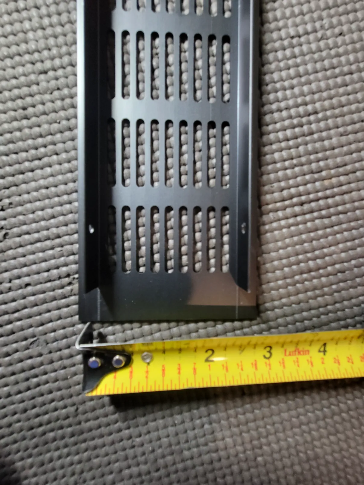 tape measure showing width of air vent