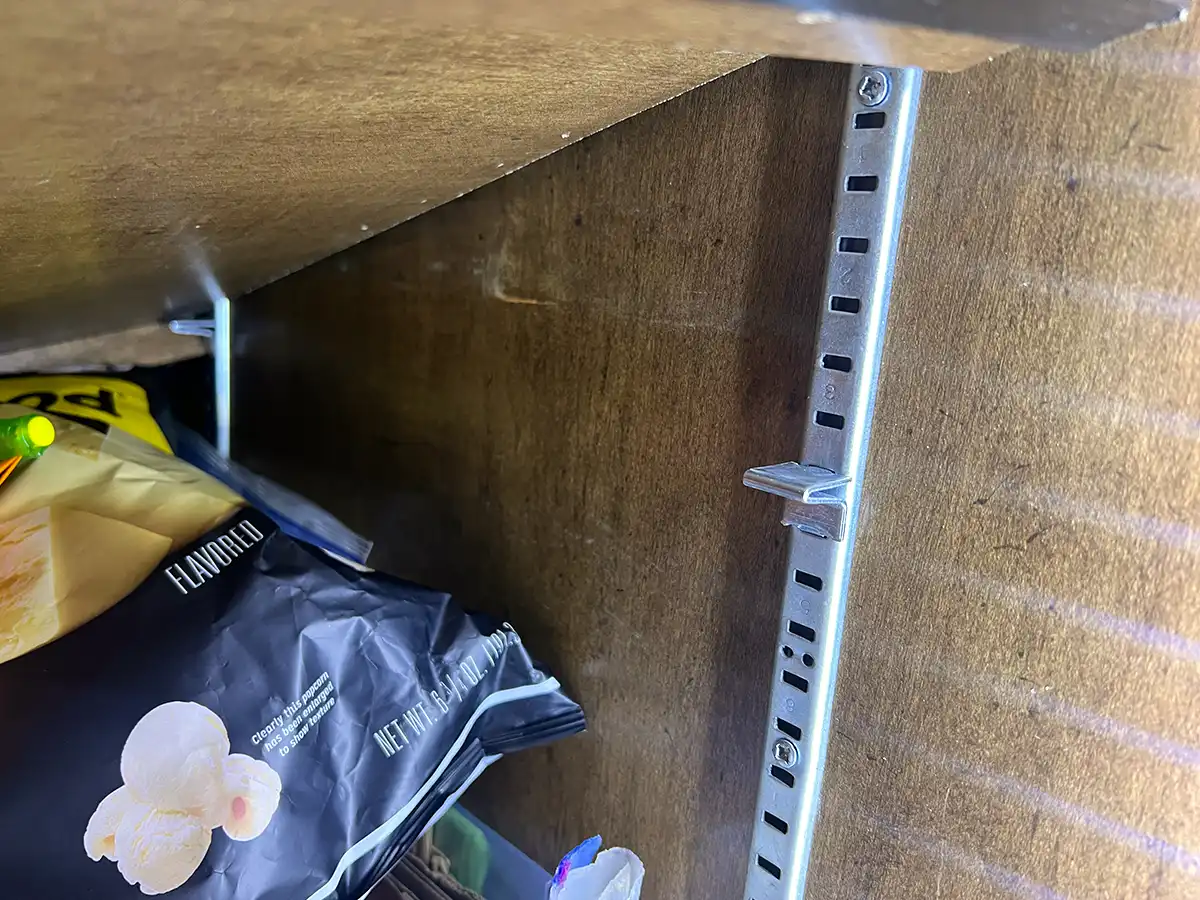 close view of a pantry shelf's original wall support