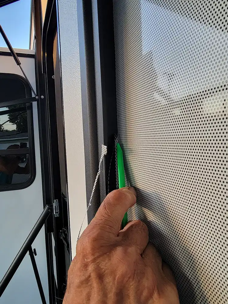 a sharp razor knife is used to trim a piece of one edge that didn’t want to cooperate